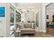 Sitting area with view of pool, natural lighting, and modern design at 5850 Saddle Oak Trl, Sarasota, FL 34241