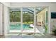 Relaxing pool area features a screened-in lanai, spa, and covered patio, offering a private outdoor retreat at 5850 Saddle Oak Trl, Sarasota, FL 34241