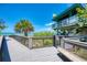 Scenic beach access with a lifeguard station, boardwalk, and views of the beach and ocean at 5872 Monroe Rd, Venice, FL 34293