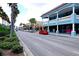 Picturesque commercial district featuring palm-lined streets, local shops, and beautiful architecture at 5872 Monroe Rd, Venice, FL 34293
