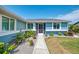 Close up of the front of the home showing the walkway and manicured landscape and plants at 5872 Monroe Rd, Venice, FL 34293
