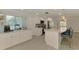 Bright kitchen featuring white cabinets, stainless appliances, and a large island at 5872 Monroe Rd, Venice, FL 34293