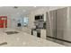 Modern kitchen features stainless steel appliances, white cabinets, and a bright white countertop at 5872 Monroe Rd, Venice, FL 34293
