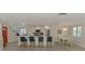 Open concept kitchen featuring white cabinets, granite counters and stainless appliances at 5872 Monroe Rd, Venice, FL 34293
