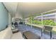 Enjoy outdoor living with this screened lanai overlooking the yard, perfect for relaxing or entertaining at 5872 Monroe Rd, Venice, FL 34293