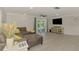 Spacious living room features tile floors, a comfortable sofa, and view of the screened patio at 5872 Monroe Rd, Venice, FL 34293
