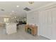 Open concept living space with tiled floors and views of kitchen and living room at 5872 Monroe Rd, Venice, FL 34293
