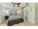 Inviting main bedroom featuring a stylish barn door leading to an ensuite bathroom and calming, coastal decor at 5872 Monroe Rd, Venice, FL 34293