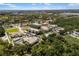 Aerial view of the condo community with pool, ponds and surrounding foliage at 600 Gardens Edge Dr # 613, Venice, FL 34285
