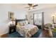 Inviting bedroom with a ceiling fan and tropical-themed decor for a relaxing, comfortable space at 600 Gardens Edge Dr # 613, Venice, FL 34285