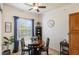 Cozy breakfast nook featuring a bright window with curtains and decorative flowers at 600 Gardens Edge Dr # 613, Venice, FL 34285