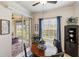 Bright breakfast nook with modern ceiling fan and sliding doors to the outdoor patio at 600 Gardens Edge Dr # 613, Venice, FL 34285