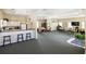 Spacious clubhouse including a kitchen area, lounge area, and dining tables at 600 Gardens Edge Dr # 613, Venice, FL 34285