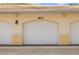 Attached one car garage with door in neutral color and trim at 600 Gardens Edge Dr # 613, Venice, FL 34285