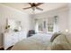 Bright main bedroom with stylish decor, hardwood floors and natural light at 600 Gardens Edge Dr # 613, Venice, FL 34285