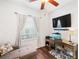 Home office featuring a desk, printer, fish tank, and natural light from a window at 600 Gardens Edge Dr # 613, Venice, FL 34285