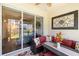 Inviting outdoor patio with comfortable seating and sliding glass doors at 600 Gardens Edge Dr # 613, Venice, FL 34285