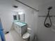This bathroom includes a sink/vanity, a toilet, and a tiled shower with a curtain at 612 Bird Bay S Dr # 308, Venice, FL 34285