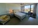 This cozy bedroom offers a large window, ceiling fan, and comfortable furniture at 612 Bird Bay S Dr # 308, Venice, FL 34285