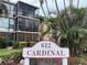 Community sign reading 612 Cardinal near the building with lush landscaping at 612 Bird Bay S Dr # 308, Venice, FL 34285