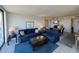 Comfortable living room featuring sofas, glass table, and sunny patio access at 612 Bird Bay S Dr # 308, Venice, FL 34285