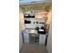 A compact closet-sized office features a light colored desk and shelving system at 612 Bird Bay S Dr # 308, Venice, FL 34285