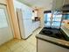 Cozy kitchen featuring updated countertops and stainless steel range at 615 S Green Cir, Venice, FL 34285