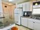 Bright kitchen with updated countertop and ample cabinet space at 615 S Green Cir, Venice, FL 34285