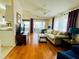 Open living room with hardwood floors and sliding doors at 615 S Green Cir, Venice, FL 34285