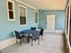 Relaxing screened patio featuring a table and chairs at 615 S Green Cir, Venice, FL 34285