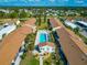 Aerial view of pool, community and lush landscaping in this community at 6796 Gasparilla Pines Blvd # 18, Englewood, FL 34224