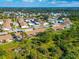 Aerial view of the home and community with lush green landscape at 6796 Gasparilla Pines Blvd # 18, Englewood, FL 34224