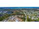 Wide aerial view of community with lakes, roads, and luscious landscaping at 6796 Gasparilla Pines Blvd # 18, Englewood, FL 34224