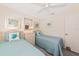 Cozy bedroom with twin beds, matching nightstand, and calming decor at 6796 Gasparilla Pines Blvd # 18, Englewood, FL 34224