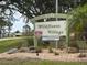Wildflower Village community sign with landscaping at 6796 Gasparilla Pines Blvd # 18, Englewood, FL 34224
