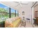 Bright Florida room with sliding windows and lots of nature light at 6796 Gasparilla Pines Blvd # 18, Englewood, FL 34224