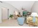 Open living space with tile floors, ceiling fan, and sliding doors to Florida room at 6796 Gasparilla Pines Blvd # 18, Englewood, FL 34224