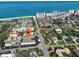 Aerial view of complex near the beach with pool, ample parking and lush landscaping at 701 Barcelona Ave # 101, Venice, FL 34285