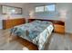 Bright bedroom with hardwood floors, generous natural light and spacious layout at 701 Barcelona Ave # 101, Venice, FL 34285