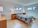 Bright bedroom with hardwood floors, generous natural light and spacious layout at 701 Barcelona Ave # 101, Venice, FL 34285