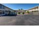 The property's paved courtyard, enclosed by buildings, offers ample parking and serene aesthetics at 701 Barcelona Ave # 101, Venice, FL 34285