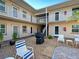 A community courtyard provides an outdoor seating area and access to residential units at 701 Barcelona Ave # 101, Venice, FL 34285