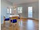 Dining area featuring wood flooring and a round table with seating for four at 701 Barcelona Ave # 101, Venice, FL 34285