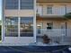 First floor unit with sliding glass door and a cozy outdoor seating area at 701 Barcelona Ave # 101, Venice, FL 34285