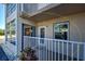 First floor unit with sliding glass door and a cozy outdoor seating area at 701 Barcelona Ave # 101, Venice, FL 34285