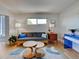 Cozy living room with a unique coffee table and window for natural light at 701 Barcelona Ave # 101, Venice, FL 34285