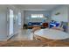 Inviting living room with hardwood floors, neutral paint and plenty of natural light at 701 Barcelona Ave # 101, Venice, FL 34285