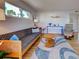 Comfortable living room boasts hardwood floors, a stylish sofa, contemporary decor and lots of natural light at 701 Barcelona Ave # 101, Venice, FL 34285