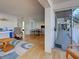 Bright living room with wood floors that leads to a dining area and outside patio at 701 Barcelona Ave # 101, Venice, FL 34285