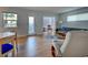 Open floor plan with dining area, living room, and access to the outside at 701 Barcelona Ave # 101, Venice, FL 34285